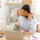 female-business-owner-entrepreneur-talking-phone-with-customer-while-preparing-packages-with-natural-beauty-products-ship (1)